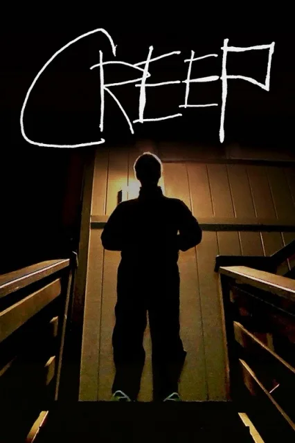 A silhouette of a person standing at the top of a wooden staircase, viewed from below, with the word 'CREEP' written in a…