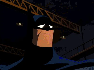 A six-panel animated GIF shows Batman in a dimly lit industrial setting, his expression shifting from stern to increasingly…