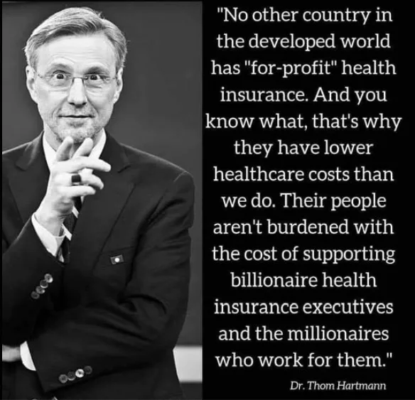 A black-and-white photo of Dr. Thom Hartmann, wearing glasses and a suit, gesturing with his hand near his chin. To his…