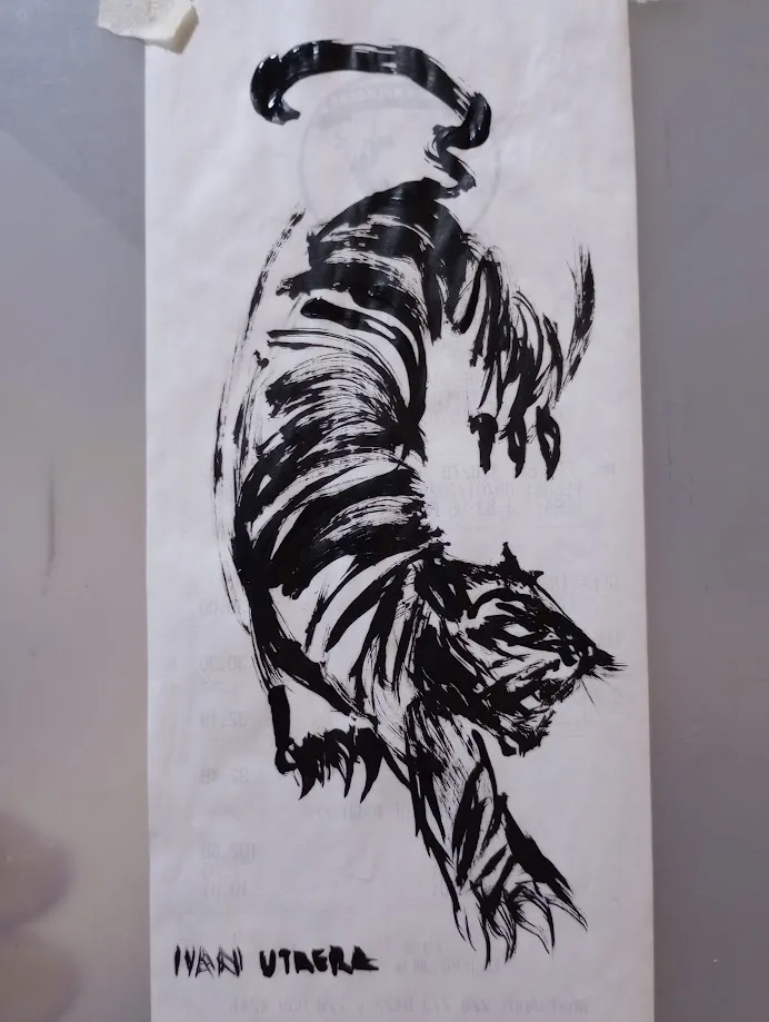 A black-and-white ink drawing of a tiger with a halo above its head, drawn on paper with faint watermark text. The artist's…