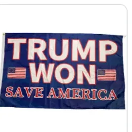 A blue flag with bold red and white text reading 'TRUMP WON' above 'SAVE AMERICA', flanked by two small American flags on…