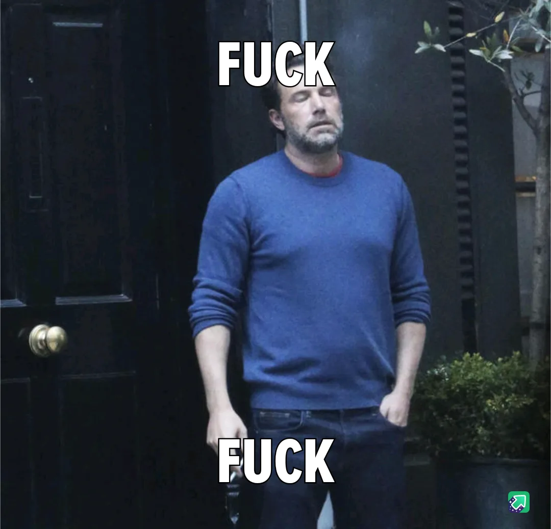 A man in a blue sweater stands outside a dark door with his eyes closed and head tilted back, conveying exasperation or…