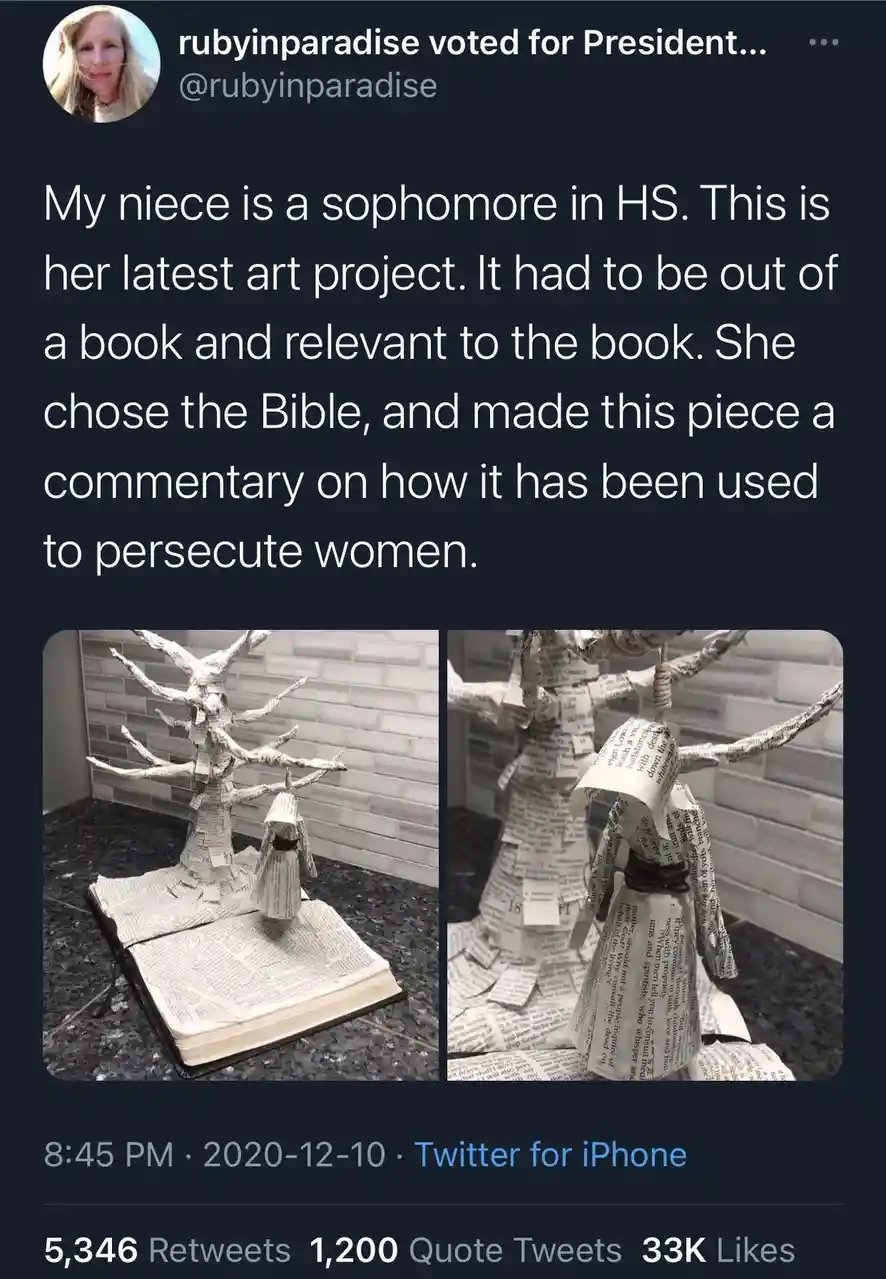 A tweet shows two photos of an art project made from pages of an open Bible. The project depicts a small, paper-wrapped…