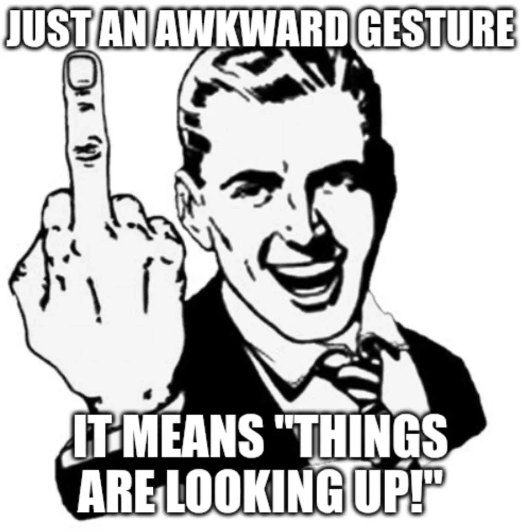 A black-and-white cartoon depicts a smiling man in a suit and tie, raising his right hand to show his middle finger. The…