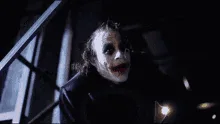 A six-frame sequence shows the Joker from 'The Dark Knight' in a dark, industrial setting, progressively revealing the words…