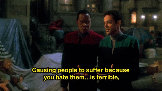 Six panels show two men in Starfleet uniforms from Star Trek: The Next Generation standing in a dimly lit, festive-looking…