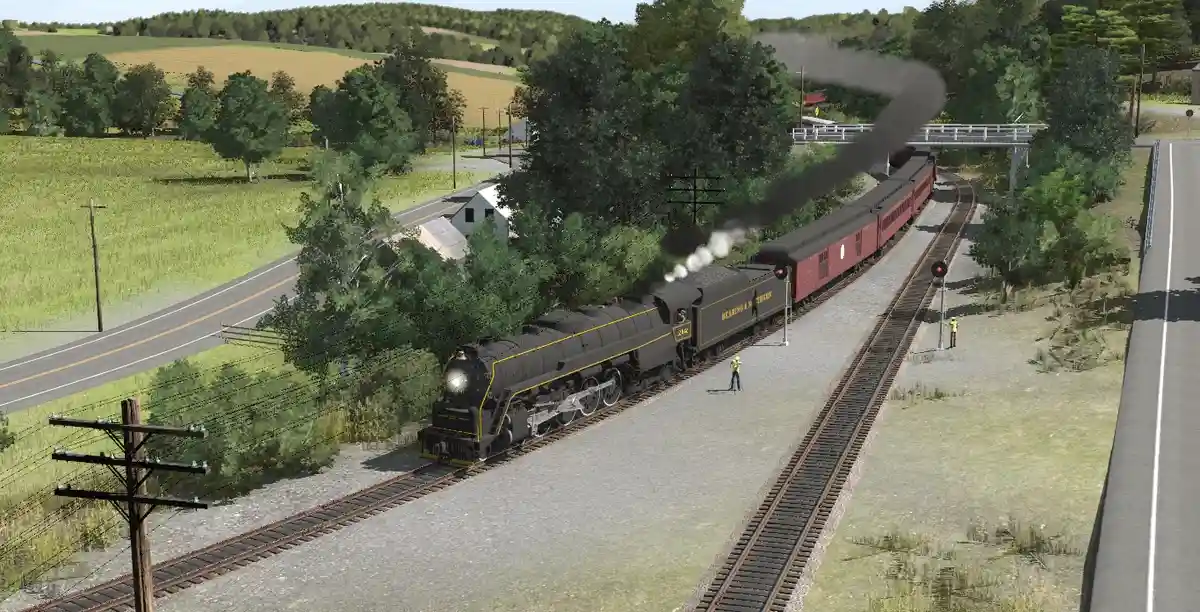 A steam locomotive with 'READING & W. TRENDS' written on its side is pulling red passenger cars through a rural landscape…