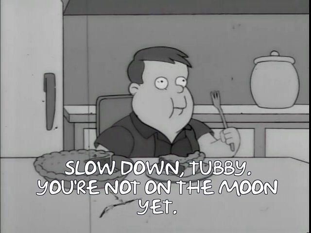 A black-and-white cartoon image shows a man sitting at a table with a plate of food, holding a fork. He has a slightly smug…