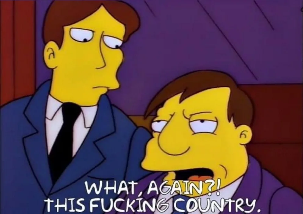 Two yellow-skinned cartoon men in suits sit side by side; the man on the right, with a frustrated expression, has text…