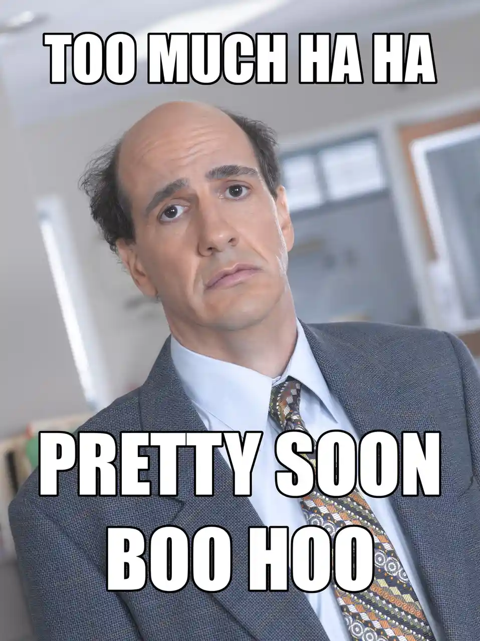 A man in a gray suit and patterned tie looks upward with a skeptical, slightly annoyed expression. The overlaid text reads…