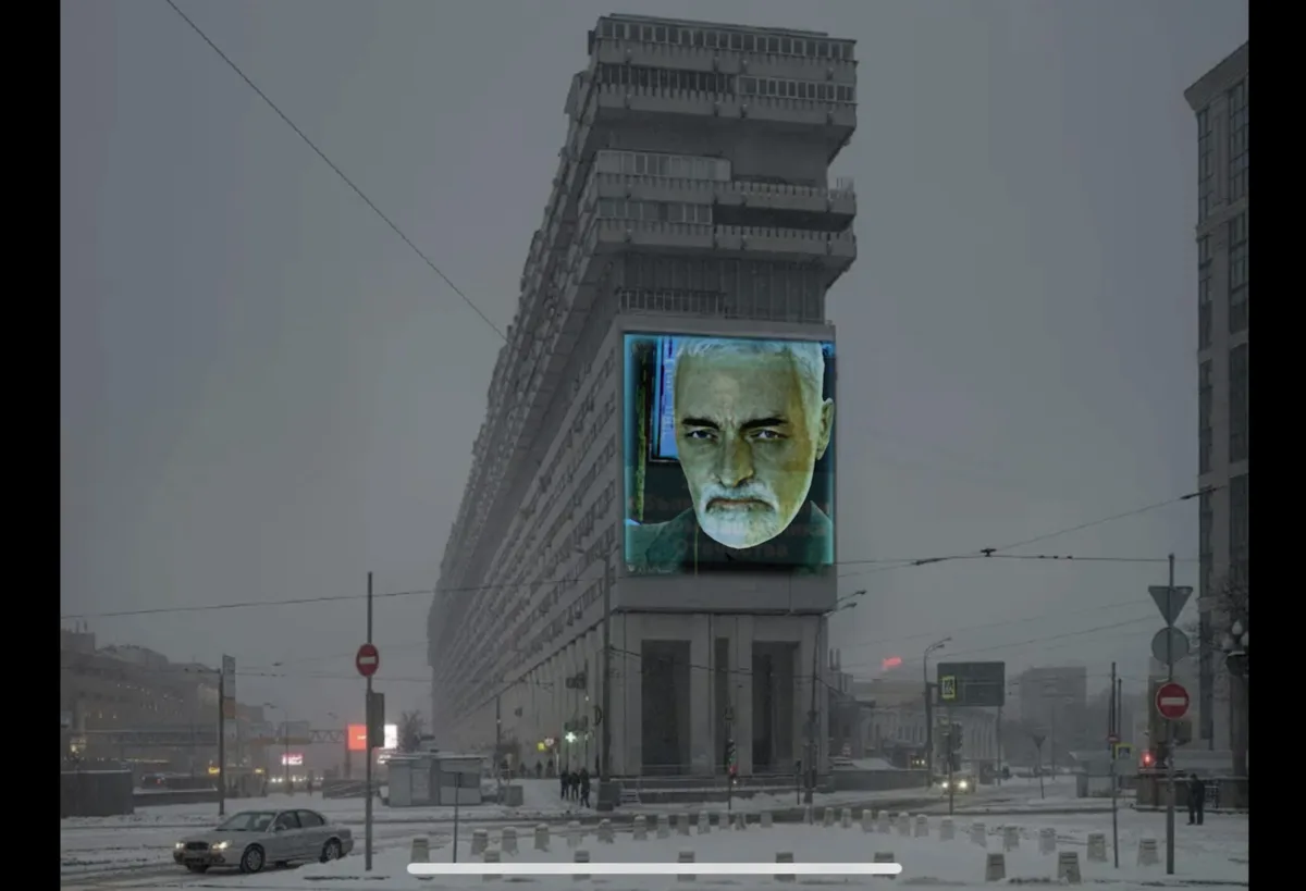 A snowy urban street scene features a large, multi-story building with a massive digital billboard displaying a close-up of…