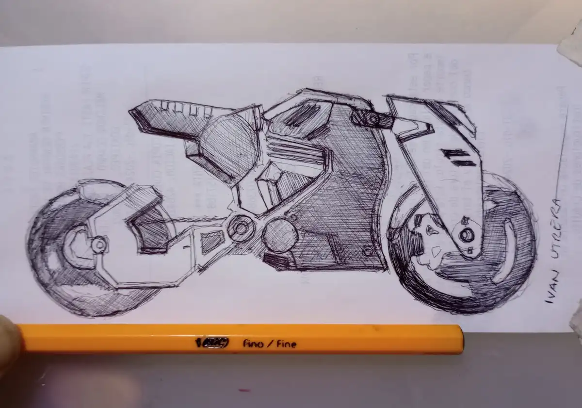 A hand-drawn pencil sketch of a futuristic motorcycle on paper, with a yellow pencil labeled 'fino / fine' resting in front…