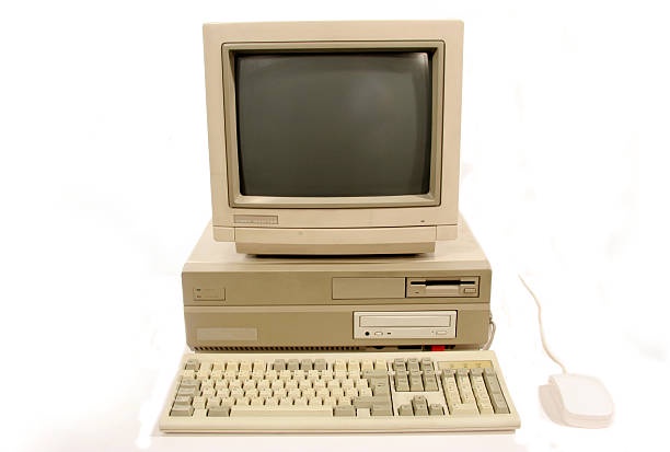 A beige, all-in-one Apple Macintosh computer from the 1990s, featuring a CRT monitor, built-in floppy drive, keyboard, and…