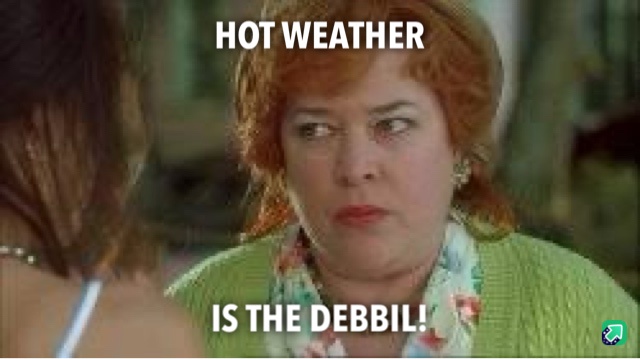 A woman with red hair and a green sweater looks annoyed while facing another person. White text overlaid on the image reads…