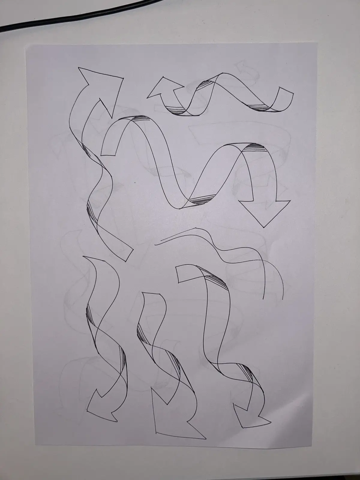 A hand-drawn black-and-white sketch on white paper shows multiple tangled, wavy arrows pointing in various directions, some…