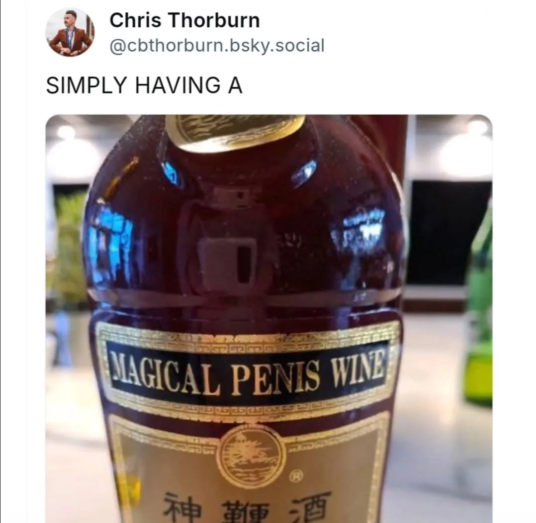 A close-up photo of a dark wine bottle with a gold and black label that reads 'MAGICAL PENIS WINE' in English and Chinese…