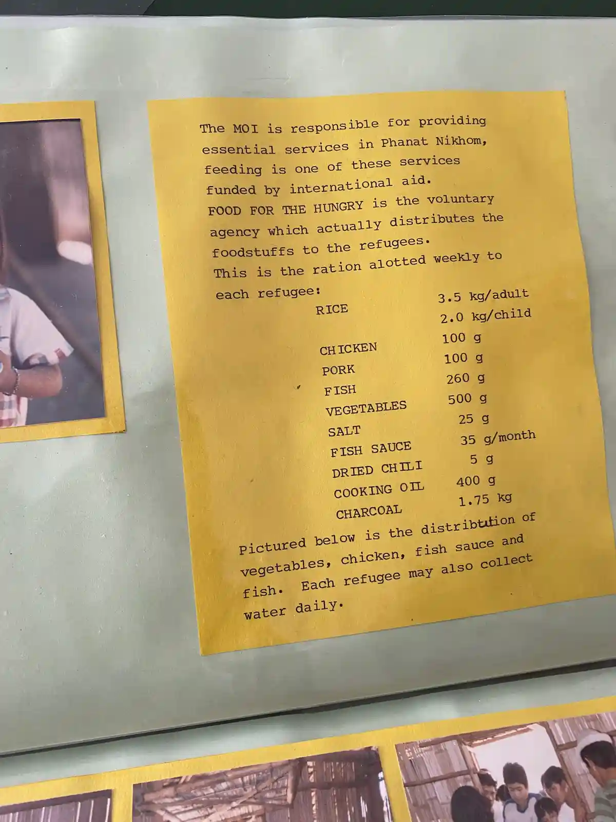 A yellow paper with typewritten text detailing weekly food rations for refugees in Phanat Nikhom, listing items like rice…