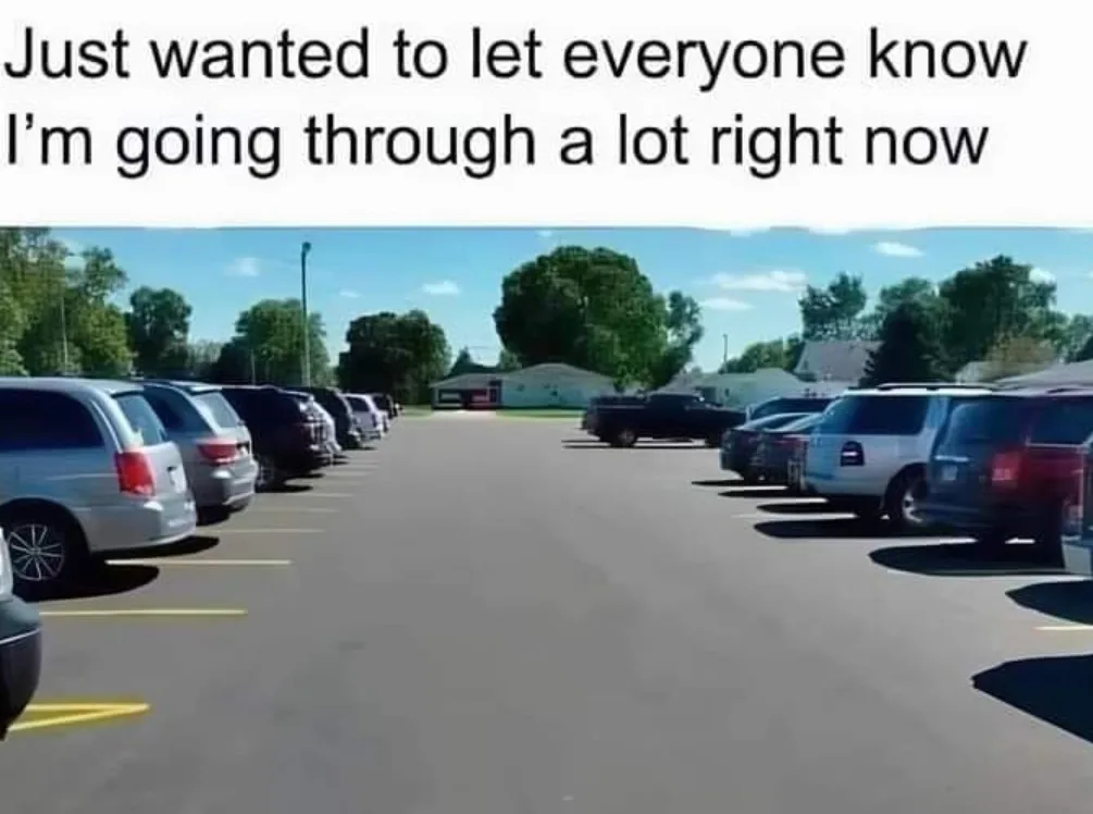 An image of a nearly empty parking lot with rows of parked cars under a clear blue sky, overlaid with the text 'Just wanted…