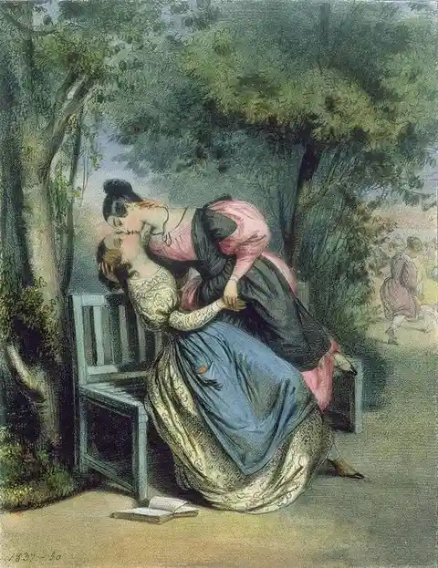 A vintage painting depicts a woman in a blue dress seated on a bench, being kissed passionately by another woman in a pink…