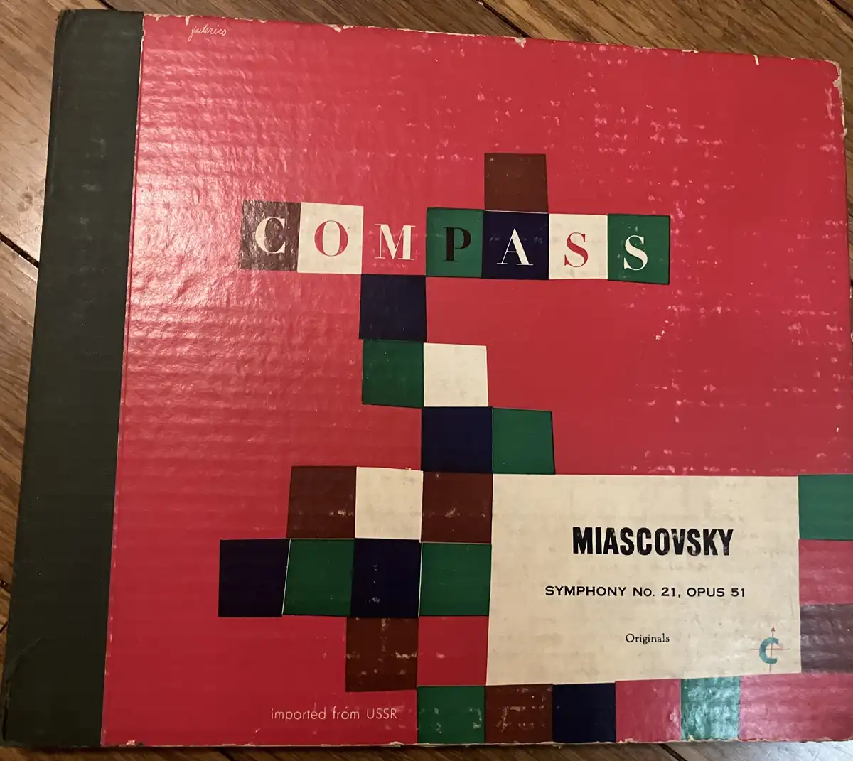 A vintage red record album cover for 'Compass' by Miasovsky, Symphony No. 21, Opus 51, features a geometric design made of…
