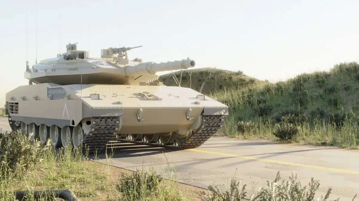 A large, modern military tank with a tan camouflage paint job is parked on the shoulder of a paved road next to grassy…