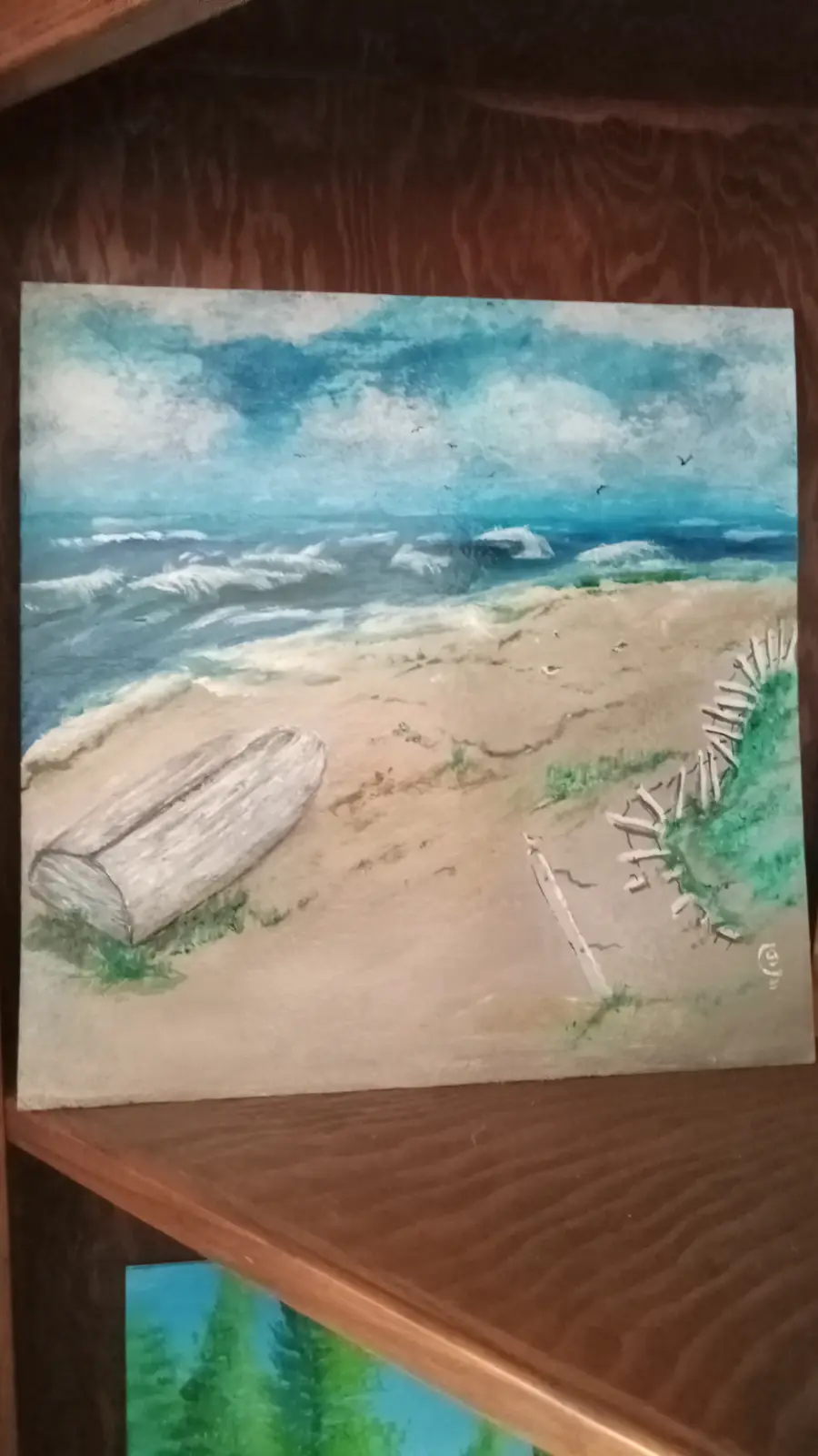 a watercolor painting depicts a stormy beach scene with crashing waves, a weathered wooden boat resting on the sand, and a…