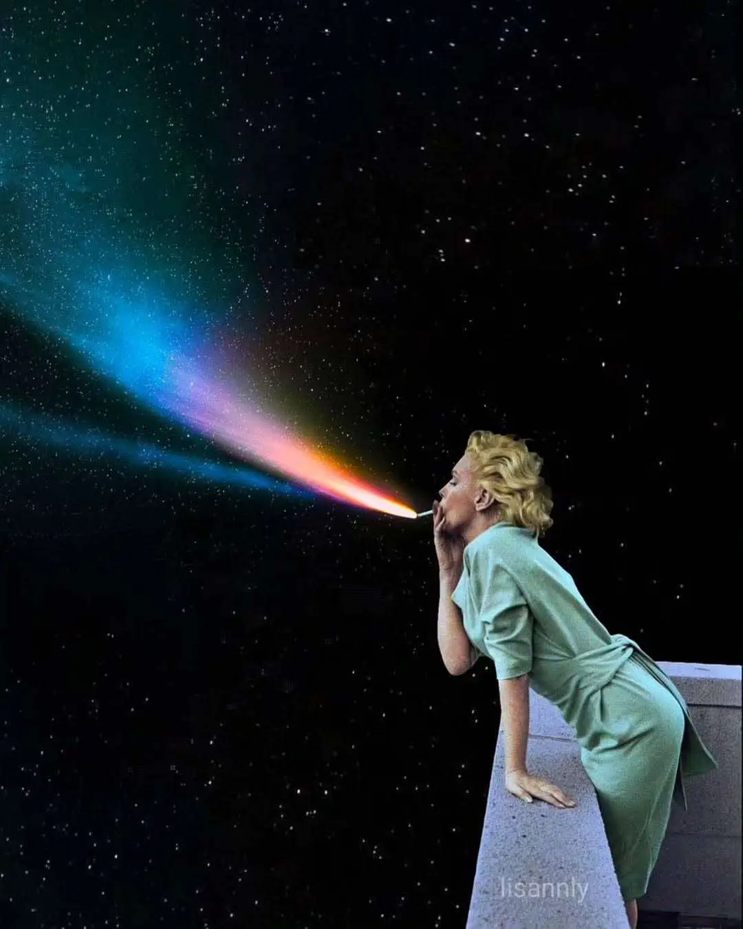 A woman in a green dress leans over a ledge against a starry night sky, blowing a colorful, rainbow-like smoke trail that…