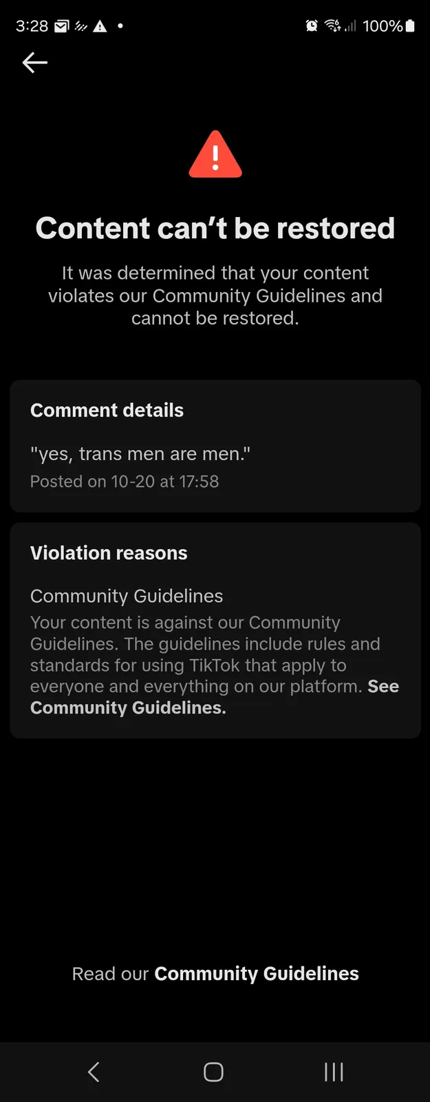 A screenshot of a TikTok content removal notice showing a red warning triangle, the message 'Content can't be restored' due…