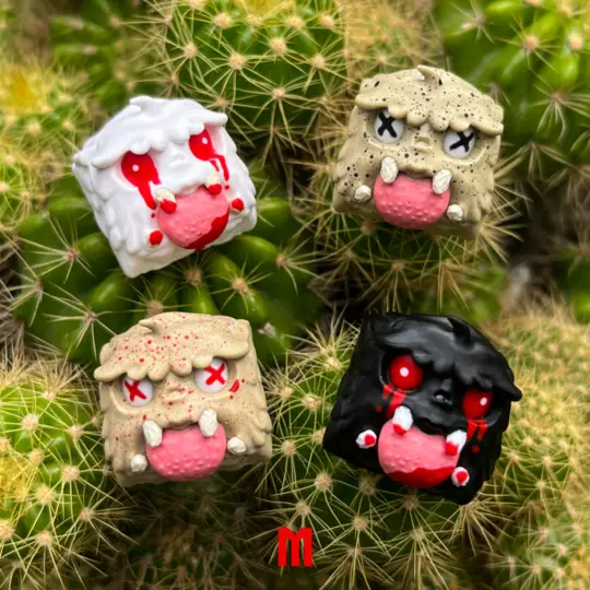 Four small, cube-shaped, cartoonish figures with exaggerated crying faces—each with red tears, X’d-out eyes, and pink…