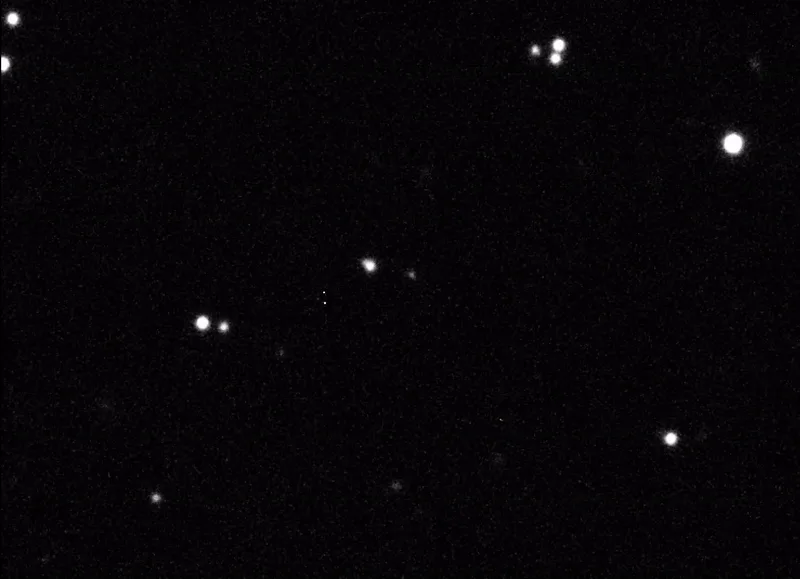The image shows two horizontal panels of a black-and-white starfield. The top panel displays faint, small dots representing…