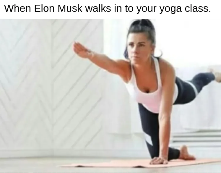 A woman in a white sports bra and black leggings is holding a yoga pose on a pink mat, looking intensely forward. The text…