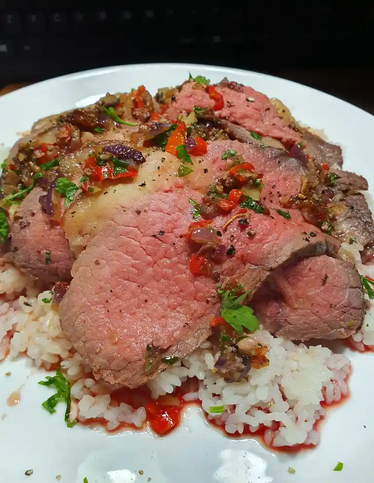 Delicious beef served over fluffy rice.