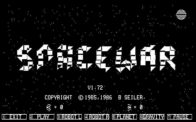 The image displays the title screen of the classic video game 'Spacewar' with pixelated white text on a black background…