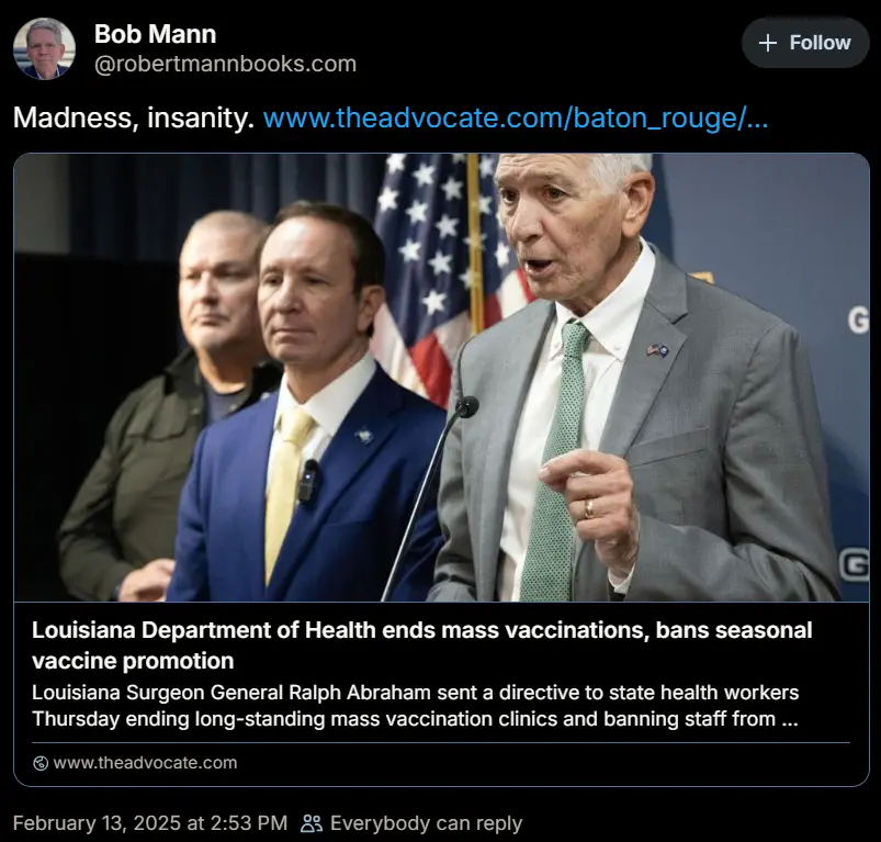 A screenshot of a tweet by Bob Mann showing a photo of three men at a press conference, with the man on the right speaking…