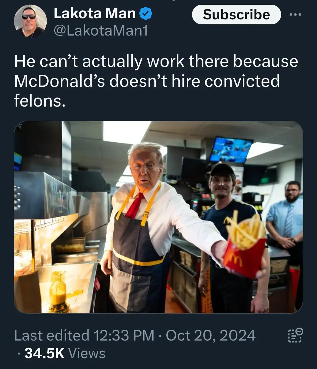 A screenshot of a social media post showing Donald Trump in a McDonald's kitchen wearing an apron and holding a fry box…