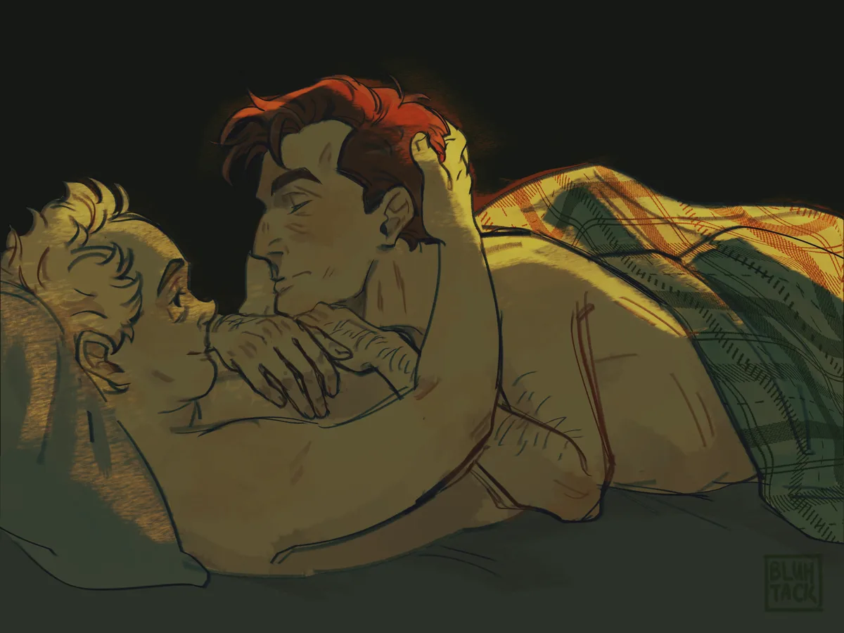 An intimate, warmly lit illustration shows two shirtless men lying in bed, one with red hair gently holding the other's head…