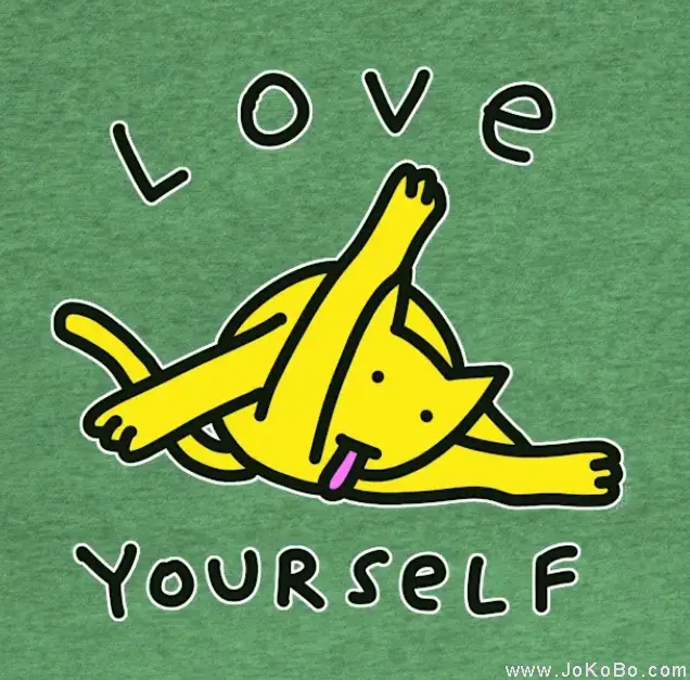 A green t-shirt features a cartoon yellow cat lying on its back in a relaxed pose with its tongue out and limbs spread. The…