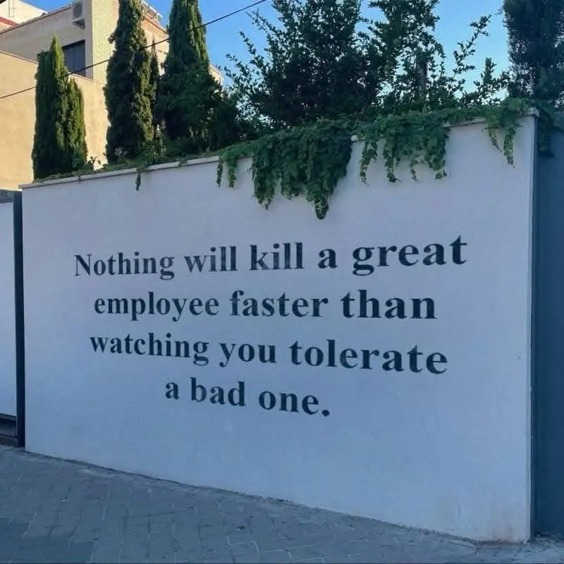 A white outdoor wall with dark text that reads 'Nothing will kill a great employee faster than watching you tolerate a bad…