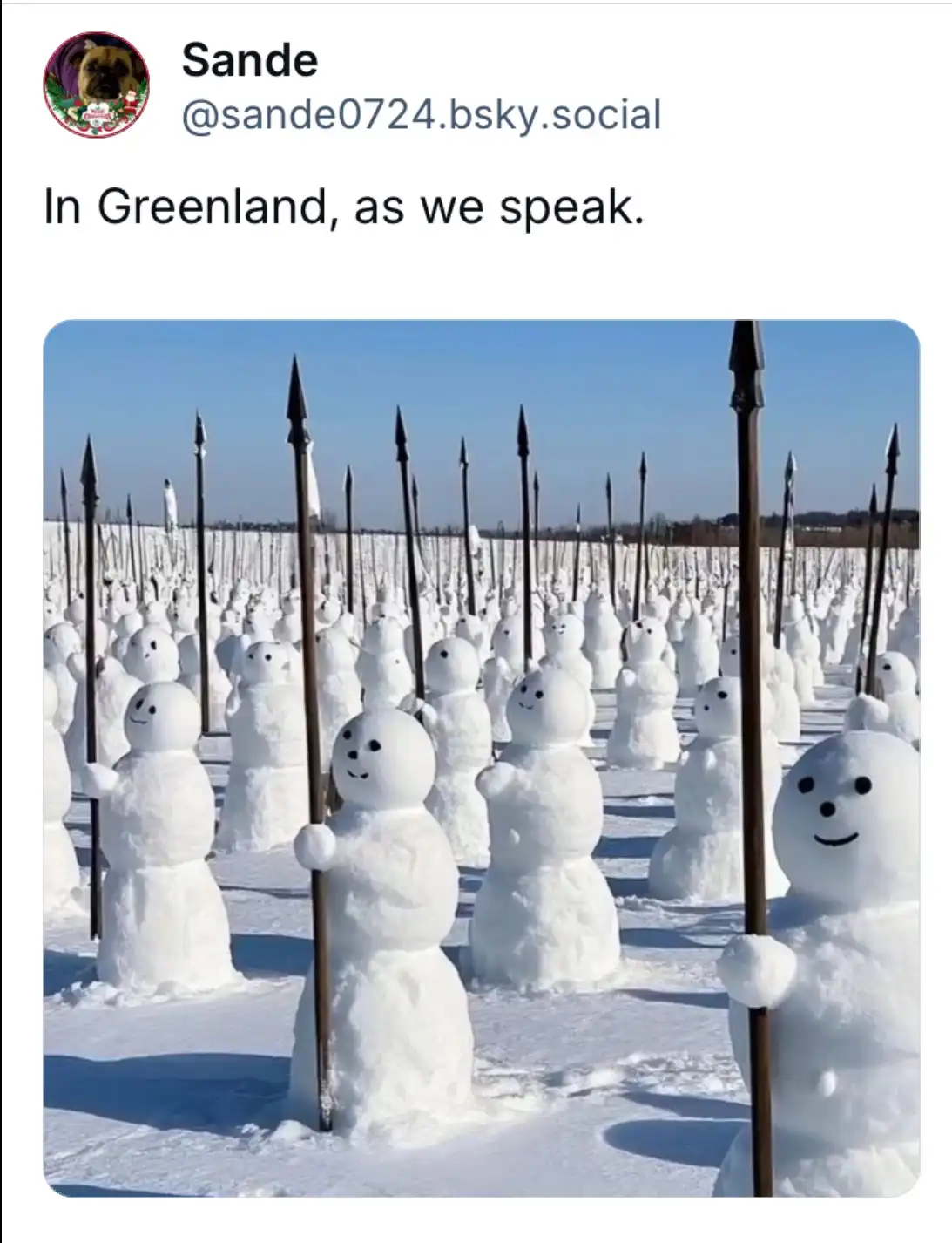 An image shows hundreds of snowmen arranged in rows across a snowy field, each holding a long, dark spear. The snowmen have…