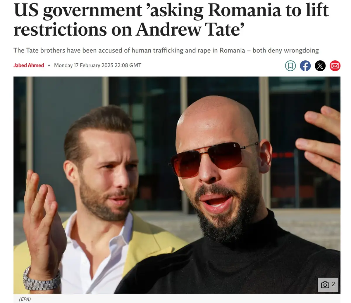 A news article screenshot shows two men, one bald with sunglasses and a black turtleneck gesturing forward, the other with a…