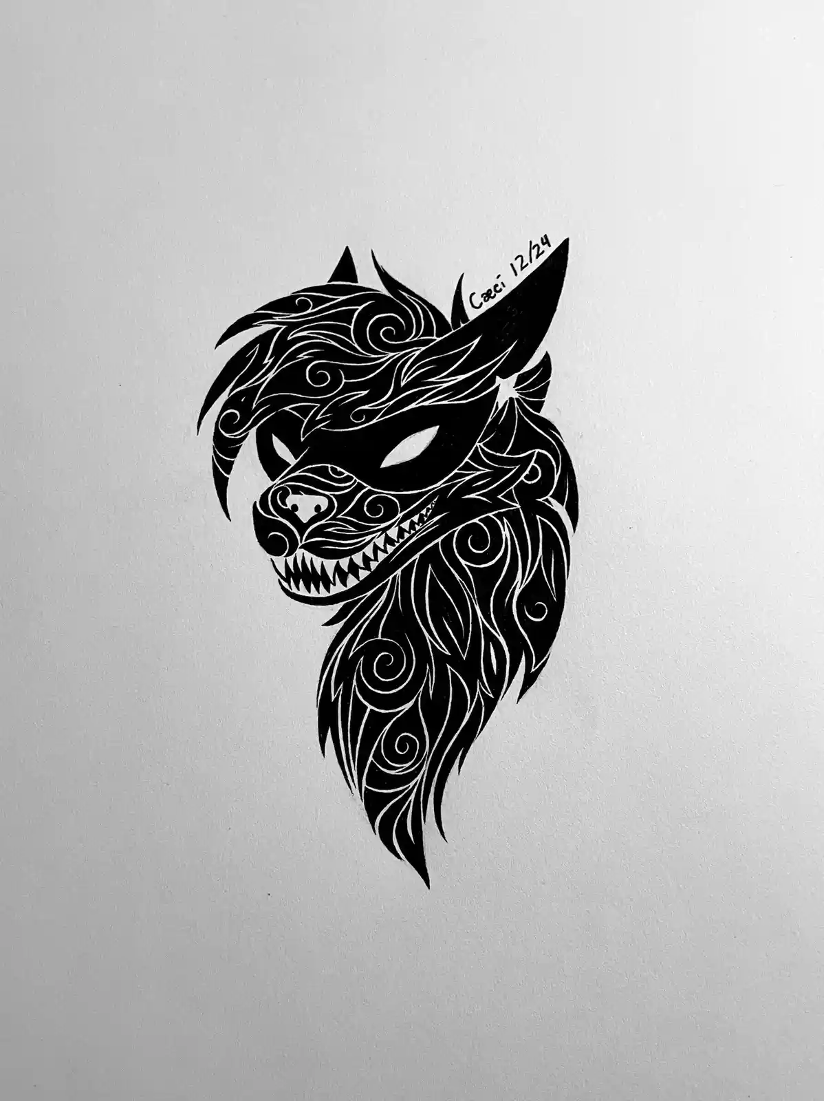A black and white stylized drawing of a wolf's head on textured paper, featuring intricate swirling tribal patterns within…