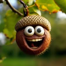 A close-up photo of a brown acorn with a woven cap, digitally edited to have large cartoon eyes and a wide, toothy grin. The…