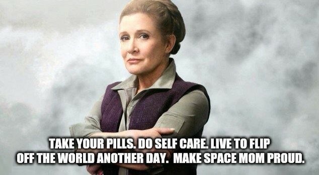 A woman with her arms crossed, wearing a purple vest over a grey shirt, stands against a smoky background. The overlaid text…