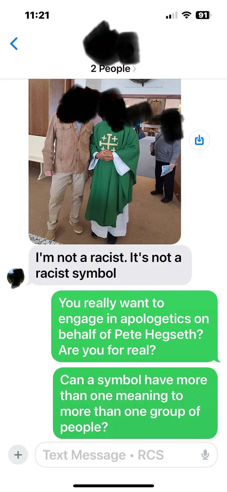 A screenshot of a text message conversation shows a person claiming 'I'm not a racist. It's not a racist symbol' while…
