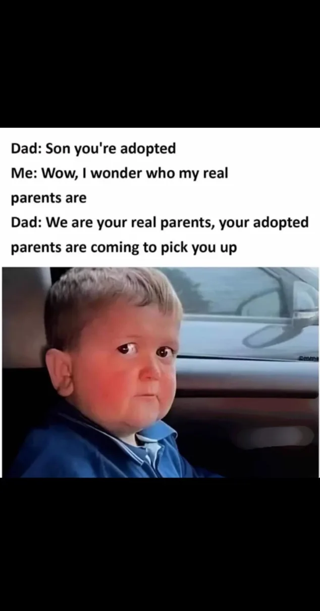 A young boy with wide eyes and a slightly confused expression sits in a car, looking forward. Overlaid text shows a dialogue…