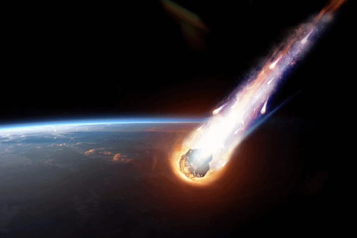 A fiery meteor streaks through space, leaving a bright trail as it heads toward Earth's curved horizon. The overlaid text…