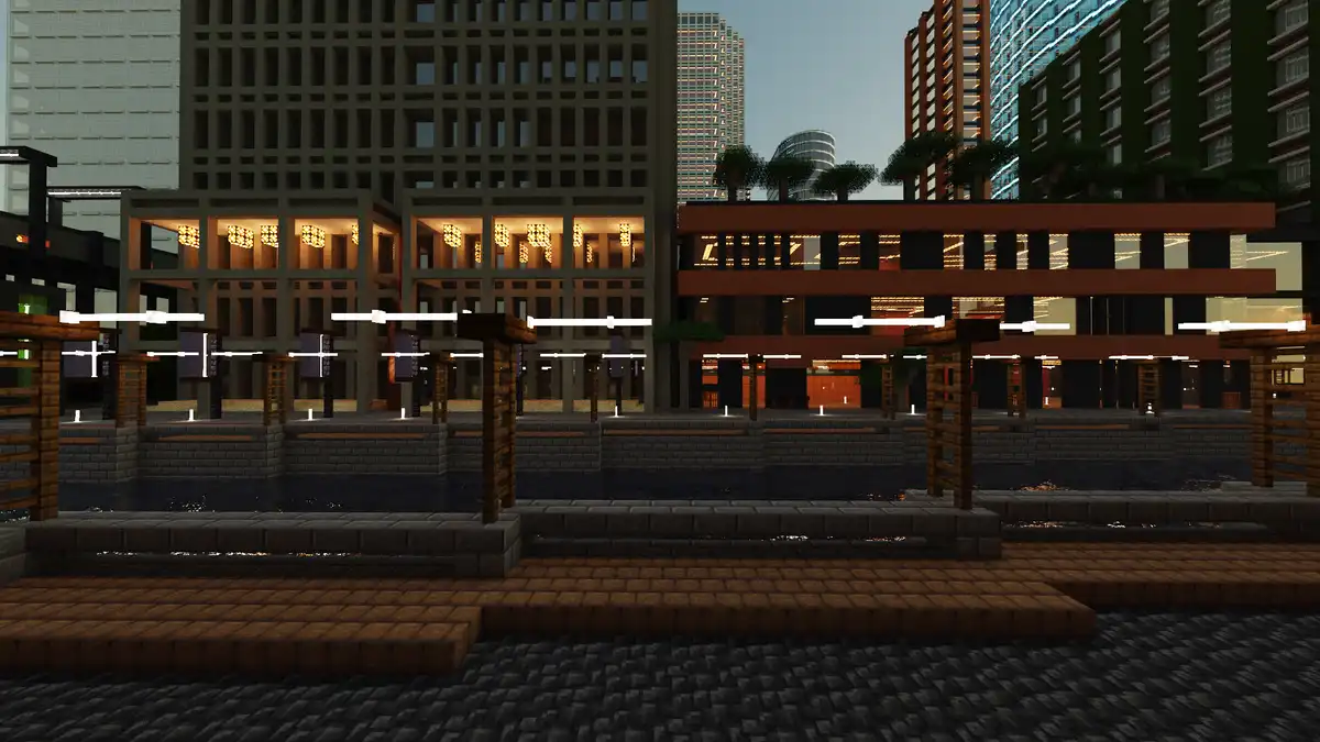 A screenshot from the game Minecraft shows a modern cityscape at dusk with tall buildings and lit windows, but in the…