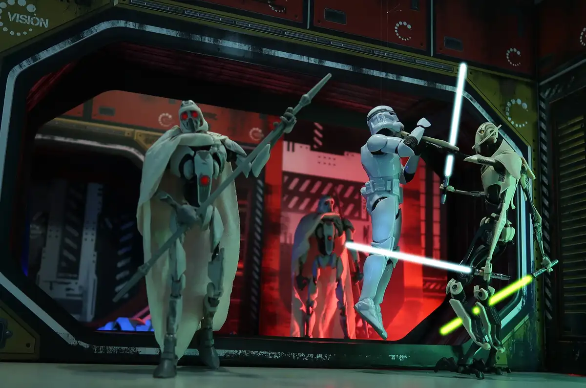 Three Star Wars action figures are posed in a sci-fi setting: a white-armored stormtrooper in the center holds a blue…