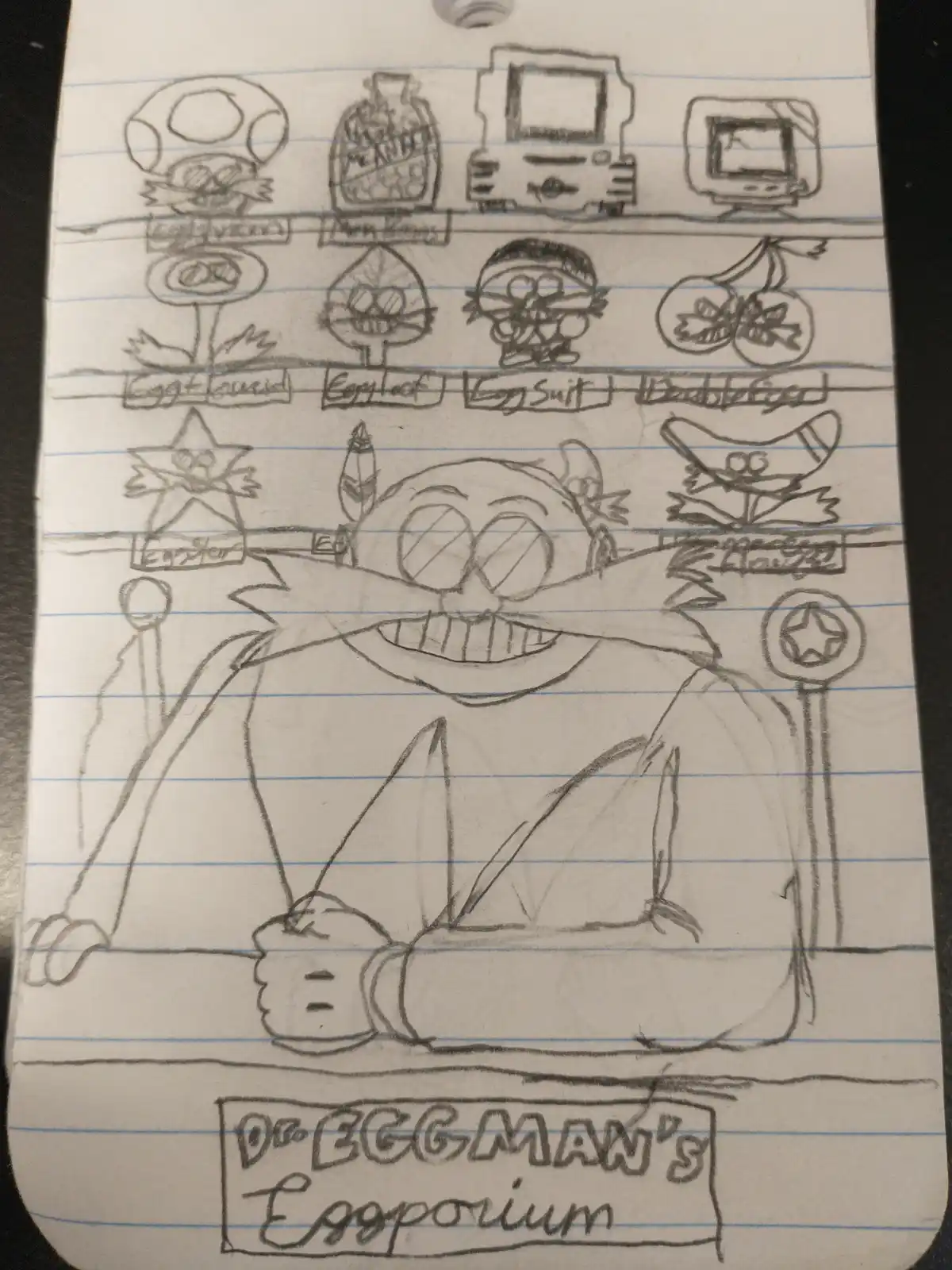 A hand-drawn pencil sketch on lined notebook paper shows Dr. Eggman sitting at a desk with a wide grin, surrounded by…