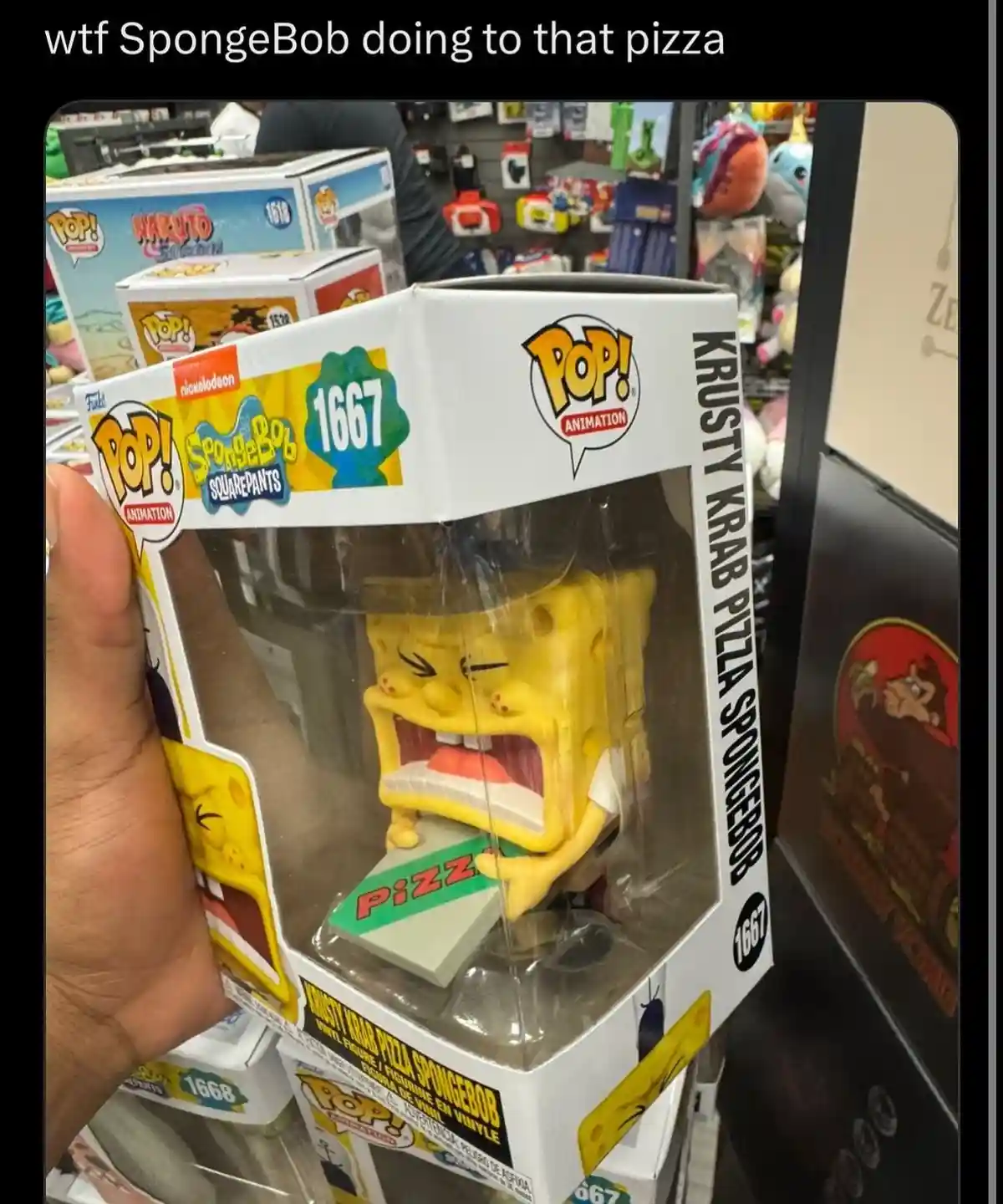 A hand holds a Funko Pop! vinyl figure of SpongeBob SquarePants, number 1667, titled 'Krusty Krab Pizza SpongeBob'. The…